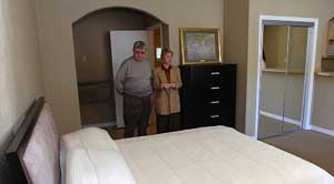 Sales manager Linda Bock, right, shows Joseph Curran, of Decatur, Mich., a unit at the Best Value Inn, a motel converting to the condo model.

MARK GUSS / Tribune